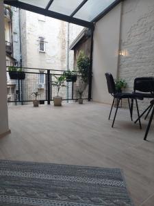 an empty patio with two chairs and a table at Bohemian in Belgrade