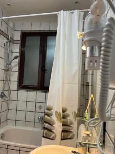 a bathroom with a shower and a sink and a tub at B&B Due Su Due Holiday in Vietri sul Mare