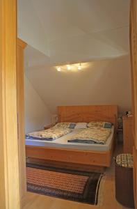 a bedroom with a bed in a room at Appartementhaus Wehrenfennig in Gosau