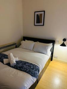 a bedroom with a bed with a pillow on it at Premium Studio Flat 05 Near Tower Bridge in London