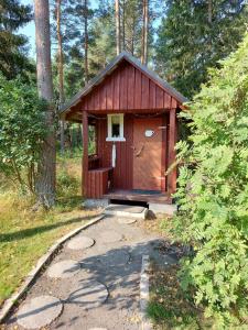 a smallshed in the middle of a forest at Ljungdahl in Korppoo
