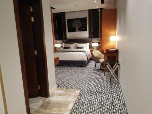 Postel nebo postele na pokoji v ubytování STwin Hotel