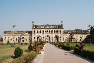 a large building with a pathway in front of it at Goroomgo Kanha Inn Lucknow in Lucknow