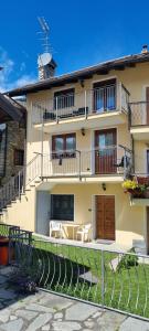 a large yellow building with a balcony at Il Paradiso CIR 0003 in Allein