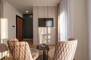 TV a/nebo společenská místnost v ubytování Dulamerovic Hotel