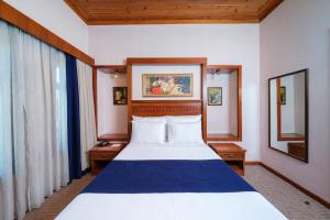 Postel nebo postele na pokoji v ubytování Hotel Bosnali