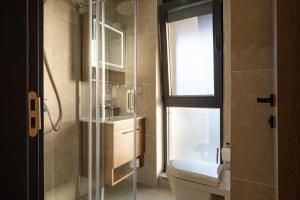 Koupelna v ubytování Dulamerovic Hotel