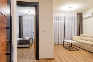 Postel nebo postele na pokoji v ubytování Dulamerovic Hotel