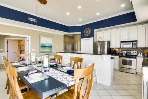 a dining room with a table and chairs in a kitchen at Ocean City Condo with Panoramic Views Walk to Beach in Ocean City