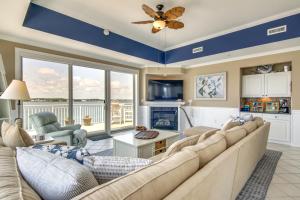 a living room with a couch and a fireplace at Ocean City Condo with Panoramic Views Walk to Beach in Ocean City