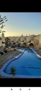 a large swimming pool in front of a building at MNG-APART Studia Mareverde D-15 Costa Adeje in Adeje