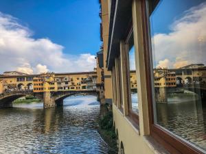 a view from a window of a bridge over a river at Leonardo luxury apartment in Florence