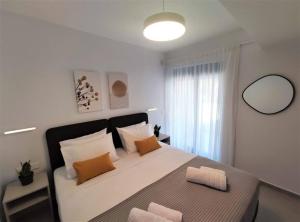 Krevet ili kreveti u jedinici u objektu Brand new condo next to the beach, peaceful square, garden view