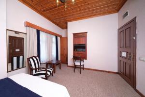 Postel nebo postele na pokoji v ubytování Hotel Bosnali