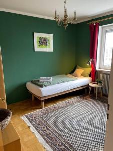 Postel nebo postele na pokoji v ubytování GLC Gauting Living Comfortable 100