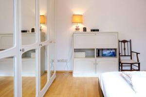 Postel nebo postele na pokoji v ubytování GLC Gauting Living Comfortable 100