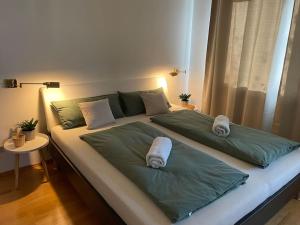 Postel nebo postele na pokoji v ubytování GLC Gauting Living Comfortable 100