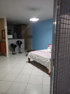 Cama ou camas em um quarto em Hotel Lumiar