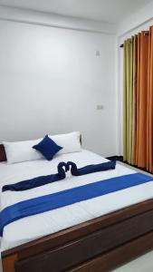 Tempat tidur dalam kamar di Calm Guest