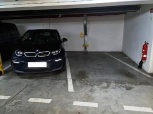 a car parked in a garage with a fire hydrant at Apartment 'ACTIVE LIFE' - near to Hockey, Football and Basketball stadium, VIVO Shopping center in Bratislava