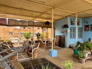 a large patio with chairs and a table at Saffron Homestay in Jaisalmer
