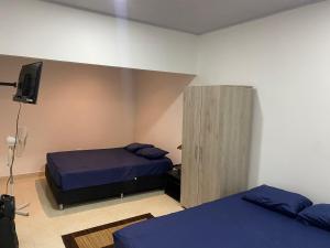 Postel nebo postele na pokoji v ubytování ApartaEstudios Viva, en la vega