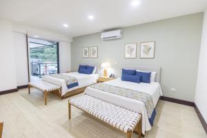 Postel nebo postele na pokoji v ubytování Paradise Bay Hotel Boutique