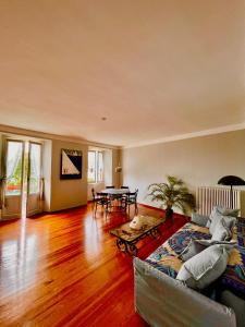 a living room with a couch and a table at Casa Gambusso historical house magnificent Lake View in Verbania