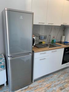 Η κουζίνα ή μικρή κουζίνα στο Perla apartment