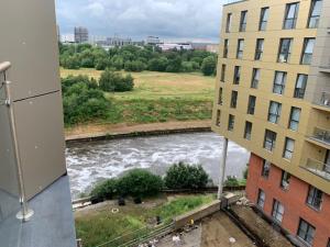 a view of a river from a building at Beautiful Manchester 2 bedroom apartment in Manchester