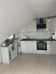 Η κουζίνα ή μικρή κουζίνα στο FMA Ferienwohnung Alfdorf