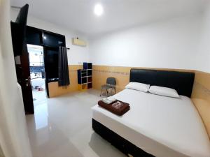 Voodi või voodid majutusasutuse Hotel Srikandi Baru toas