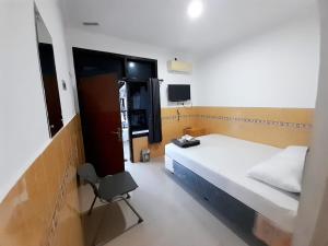 Voodi või voodid majutusasutuse Hotel Srikandi Baru toas