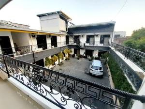 a car parked in a parking lot on a balcony at Hotel Srikandi Baru in Yogyakarta