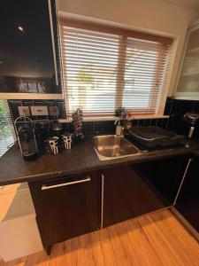 a kitchen counter with a sink and a window at Luxury Home in Dublin WiFi TV B&B Close to City Centre in Lucan