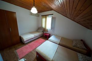 Postel nebo postele na pokoji v ubytování Apartments Pavićević