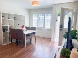 a dining room with a table and chairs at Van West Serene Retreat Close to UBC and Downtown in Vancouver