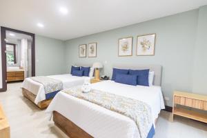 Postel nebo postele na pokoji v ubytování Paradise Bay Hotel Boutique