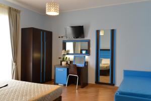 Postel nebo postele na pokoji v ubytování Hotel Rosignano