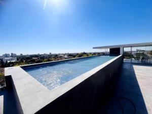 a swimming pool on the roof of a house at Departamento 2do y 3er anillo in Santa Cruz de la Sierra