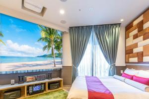 a bedroom with a large window with a view of the beach at Hotel Pasela Living in Tokyo