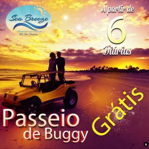a poster of a couple sitting on a car on the beach at VG Sun Cumbuco Sea Breeze Vista Mar in Cumbuco