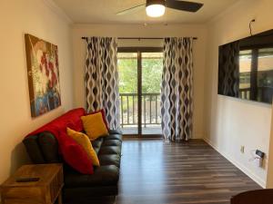 a living room with a couch and a sliding glass door at Lucky #9 Hot Springs in Hot Springs