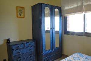 Posteľ alebo postele v izbe v ubytovaní Meddays Apartamento la Caleta Ático