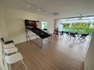 a room with a table and chairs and a dining room at Puchong New Private Pool & Jacuzzi up to 30 Pax in Puchong