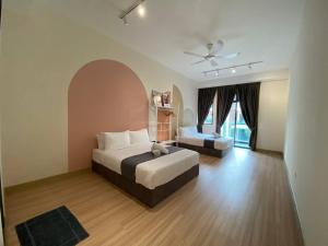 a bedroom with two beds and a large window at Puchong New Private Pool & Jacuzzi up to 30 Pax in Puchong