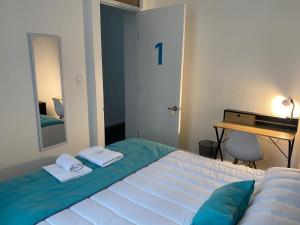 En eller flere senger på et rom på Casona Gorbea Hotel
