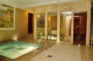 a large bathroom with a hot tub in a building at Hotel Parus in Nizhny Novgorod