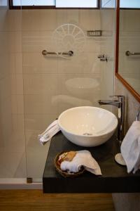 a bathroom with a sink and a shower at Inkantari Boutique Hotel in Cusco