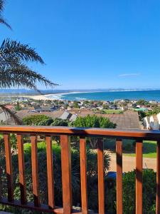 a view of the ocean from a balcony at A1 Kynaston self catering or bed and breakfast solarpower in Jeffreys Bay